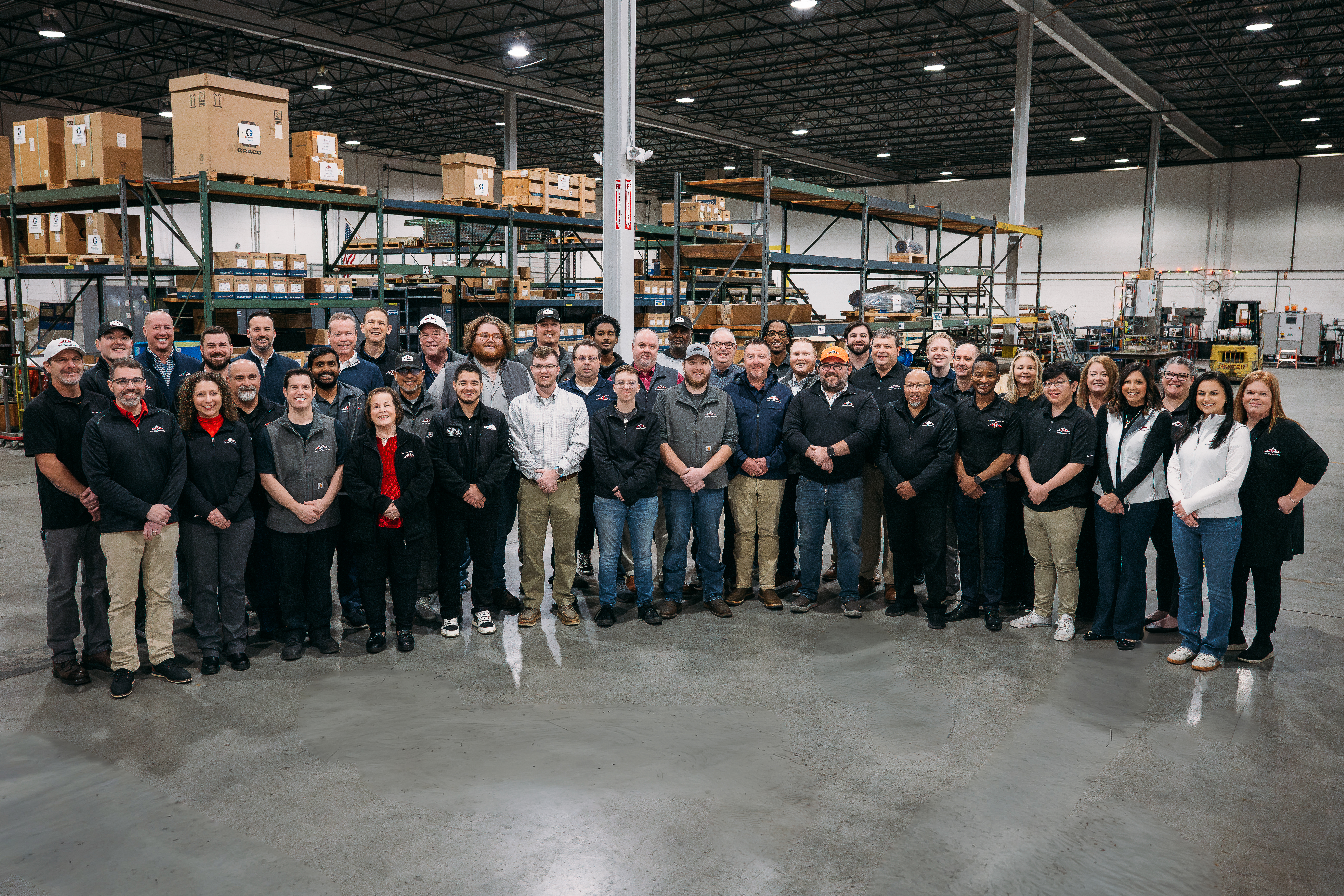 cejco team group photo inside their warehouse in lawrenceville, ga