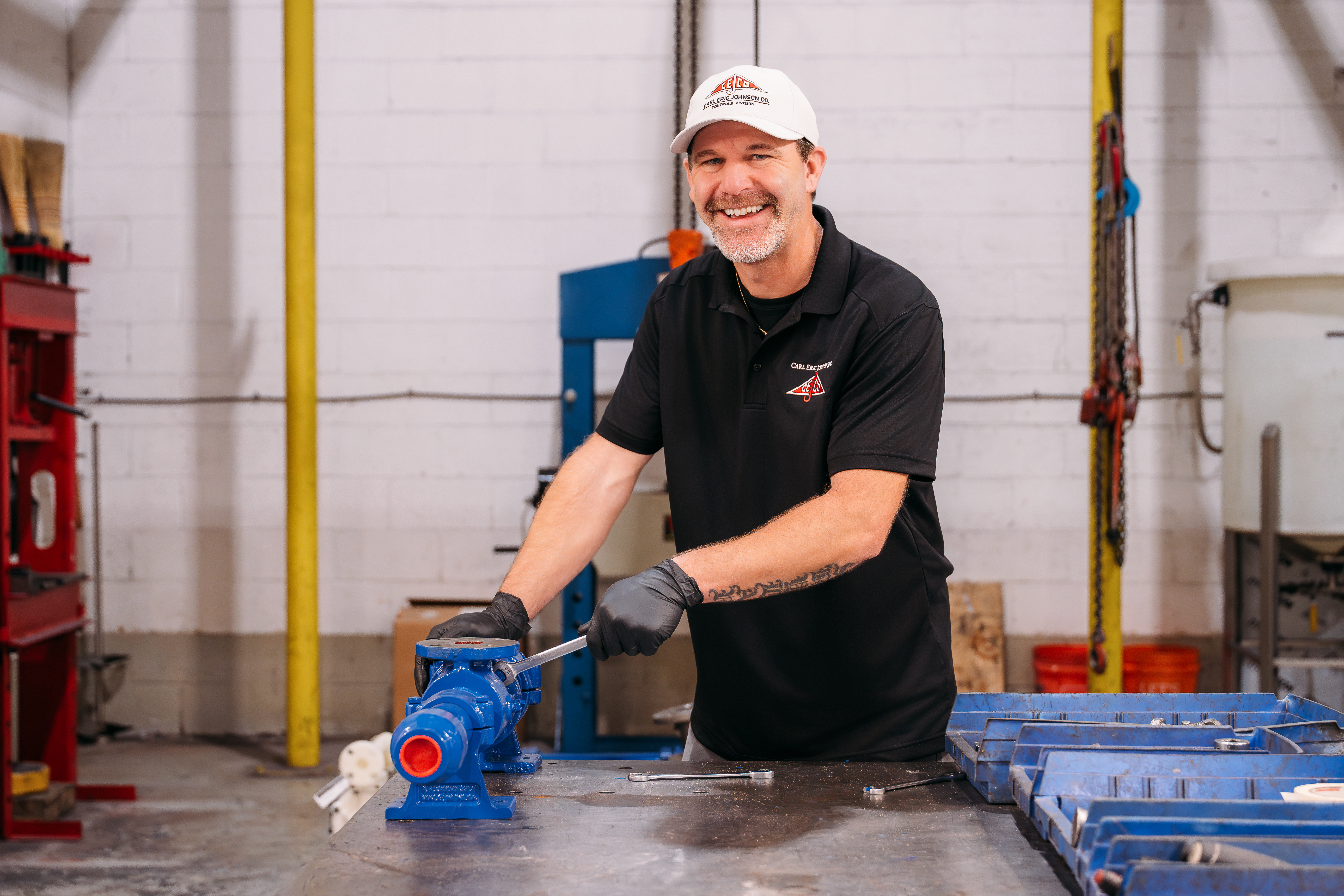 cejco employee servicing a pump to prevent maintenance issues.